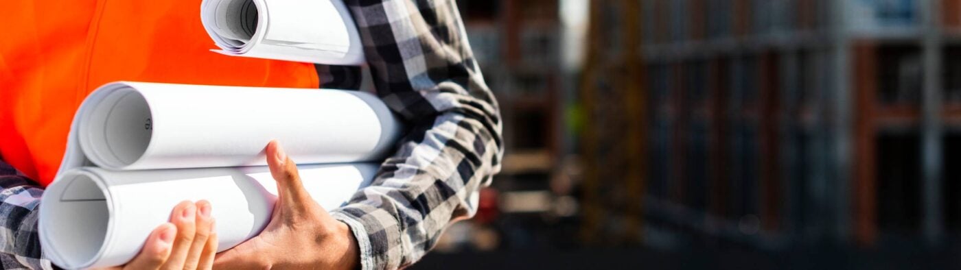 Close Up Construction Engineer Holding Plans Hands(1)