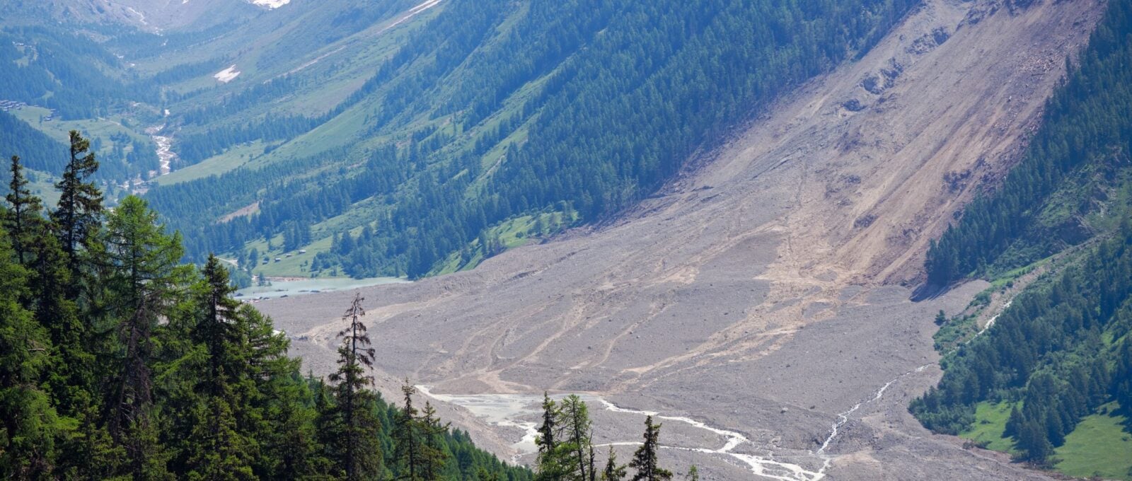 Aerial,View,Of,Rockfall,With,Gravel,And,Lonza,River,At