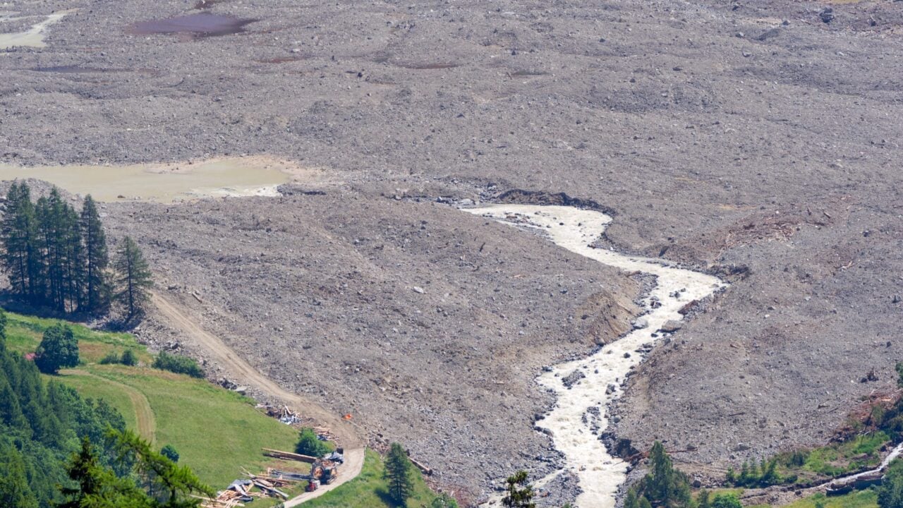 Aerial,View,Of,Rockfall,With,Gravel,And,Lonza,River,At